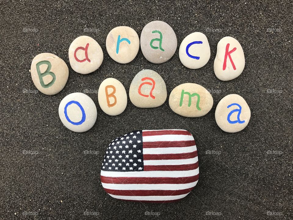 Barack Obama, 44th President of the United States of America with carved and colored stones over volcanic sand 