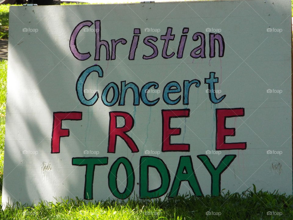 concert in a park sign