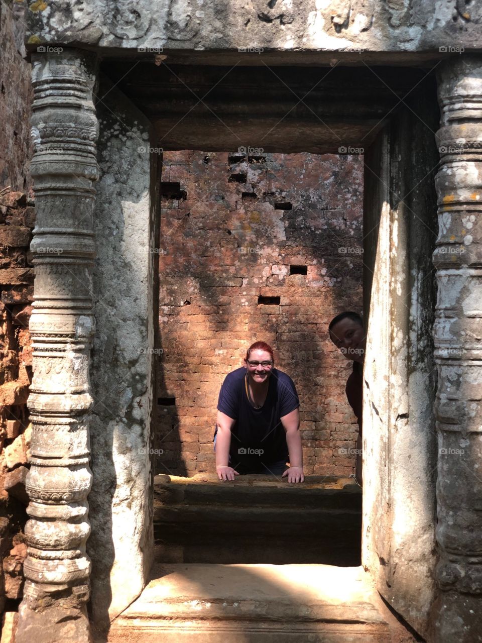 Hindu and Buddhist Columns framed by a Person