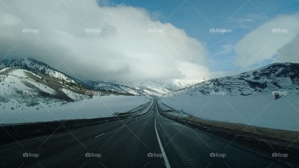 Road through snow covered hills