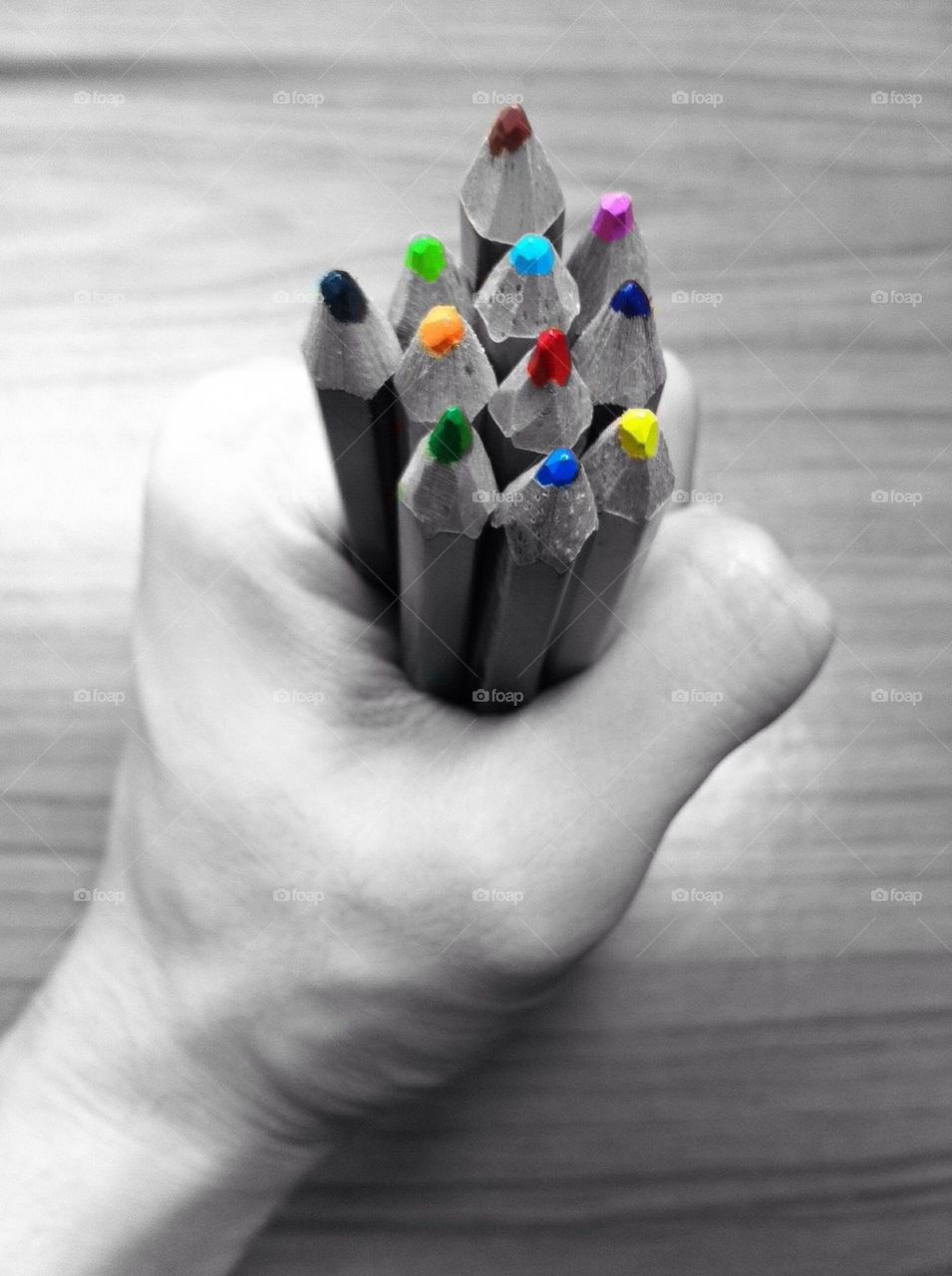 Color pencils in someone hand