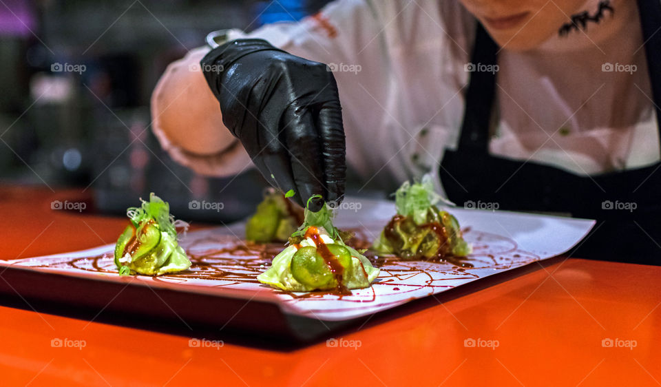 Chef cooking dumplings at a high cuisine restaurant