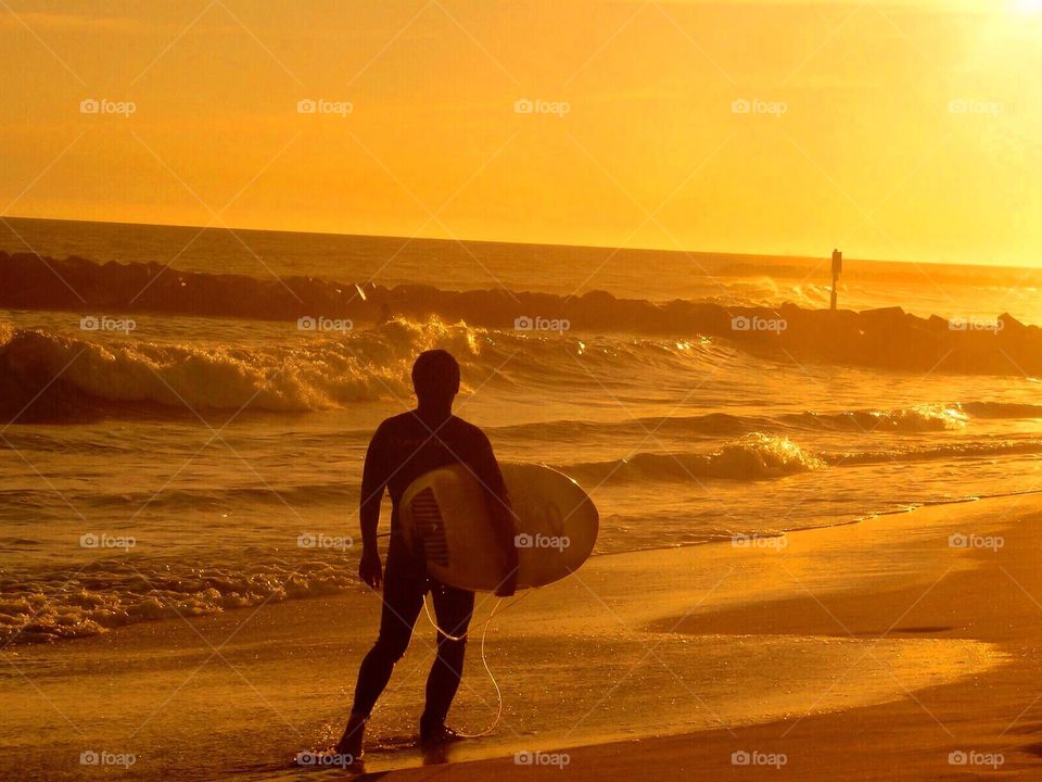 Surfer at Sunset Newport Beach California 