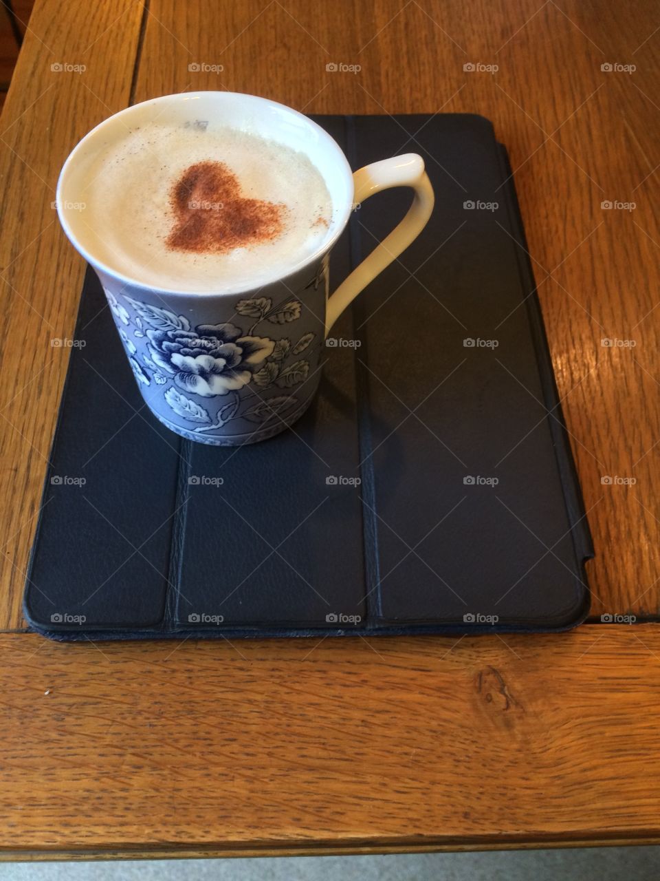 Cup of coffee with cinnamon heart sprinkle 