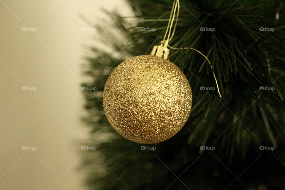Golden ball on the Christmas tree