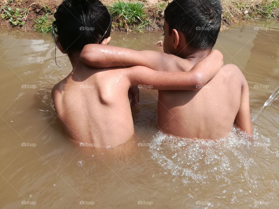 enjoying ,playing outdoors,caring,playing