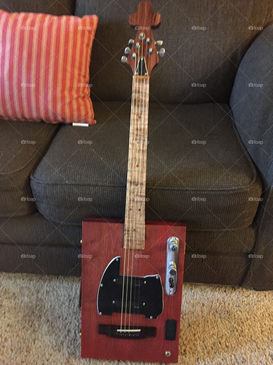 Five string handmade wooden red stained with telecaster volume control emf pickups battery powered with acoustic guitar bridge. Delightful!