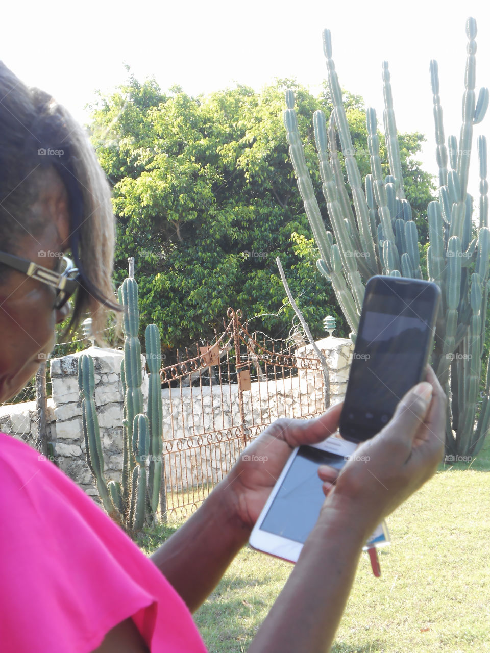 Woman Taking Pictures With Cell Phone.