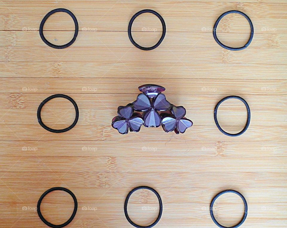 Hair accessories arranged on a wood surface