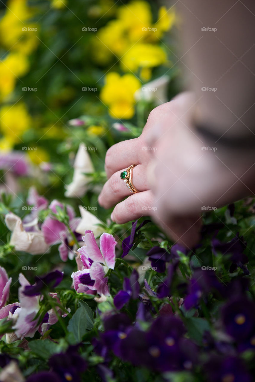 colors of spring - beautiful colorful flowers with couple's hands and green ring