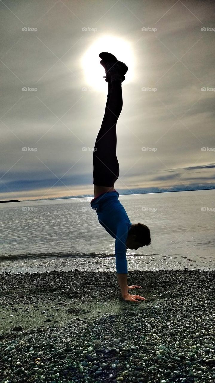 yoga beach handstand