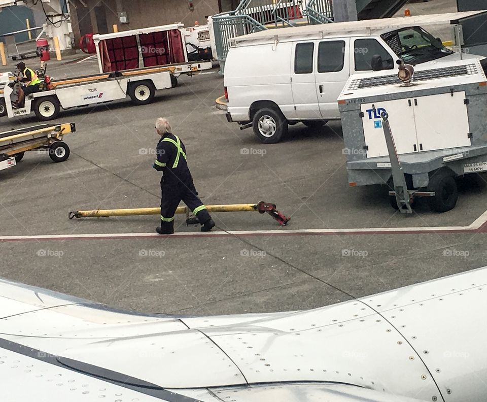 On a recent flight the tow bar pushing our airplane away from the gate snapped broke causing quite a jolt to passengers and crew and a loud bang, damaging the aircraft, and causing our flight cancellation. Here is the scene outside the airplane window 