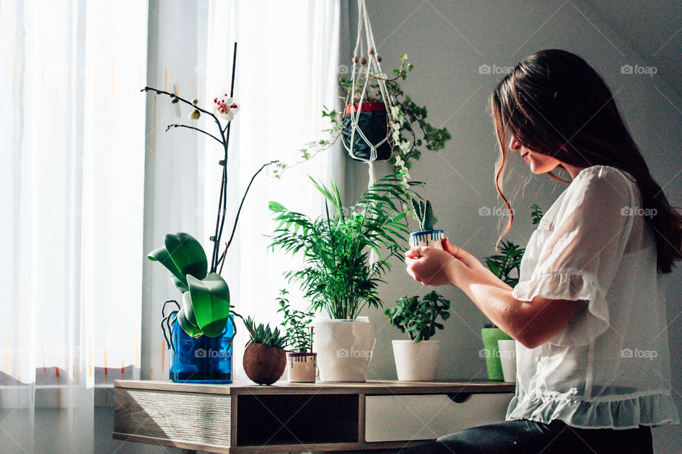 woman holding her plant