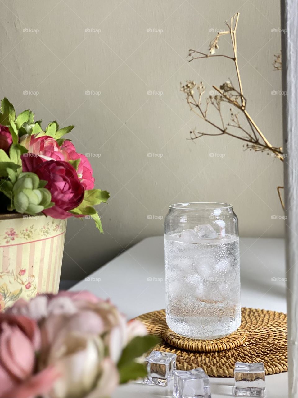 A cold drink pure water in the glass on the table.