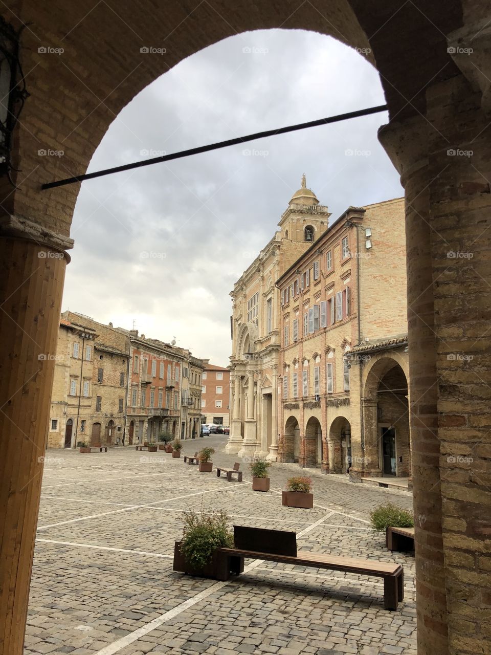 Offida, medieval town, Italy, view on the main square, Piazza del Popolo and the church Collegiata di Santa Maria Assunta