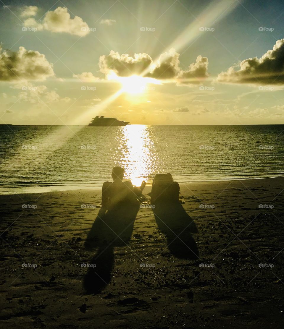 A couple enjoying sunset in the beach