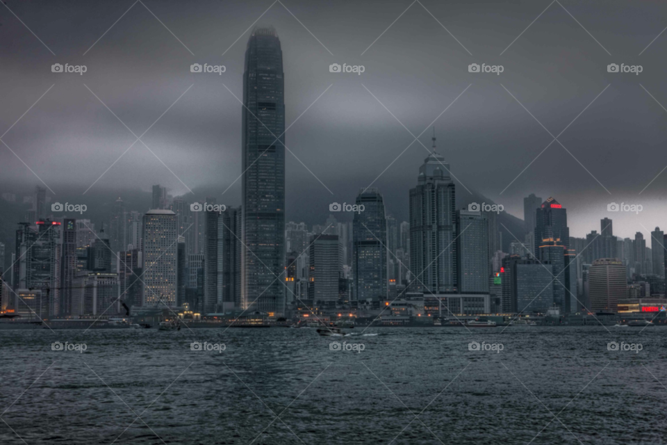 dark clouds buildings skyline by paulcowell