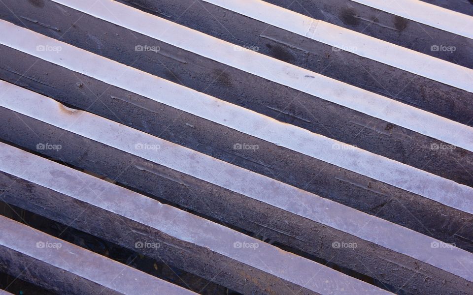 A closeup  of a linear grate on the street in San Miguel de Allende, Mexico,