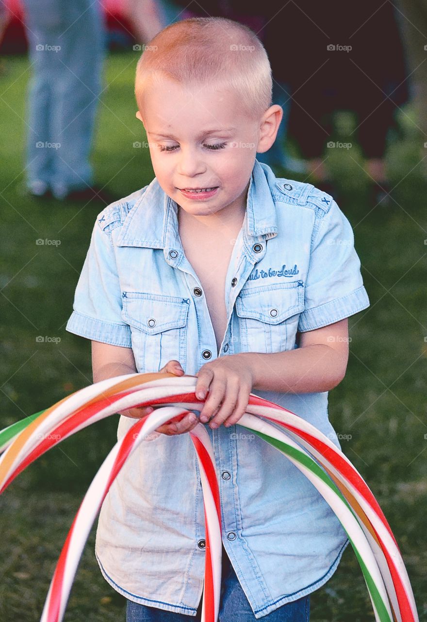 Boy with hula hoops