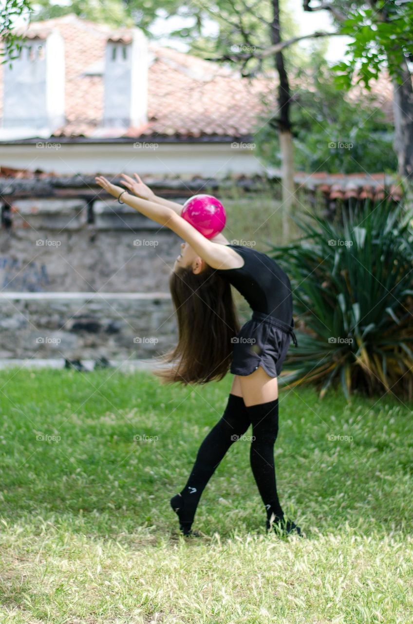 Beautiful Young Gimnast Dancing in Nature