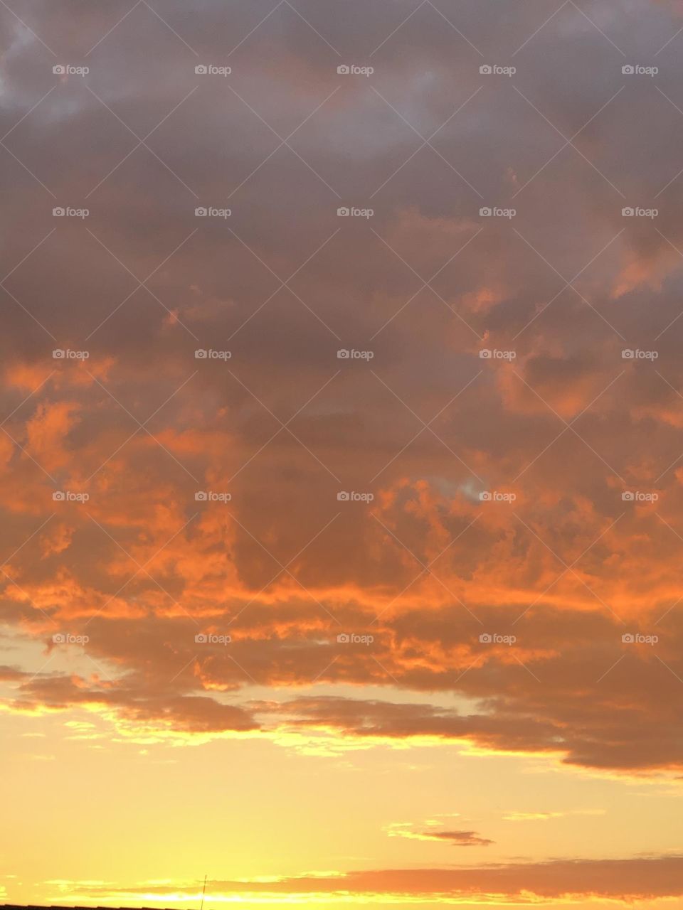 Sunrise fire in the sky over the ocean 