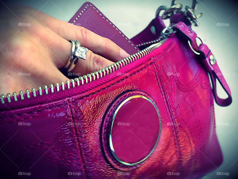 Hand in purse