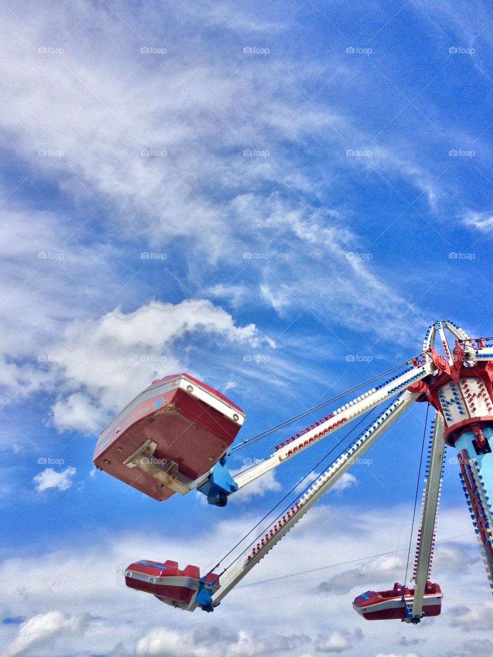 Carnival ride against blue sky 