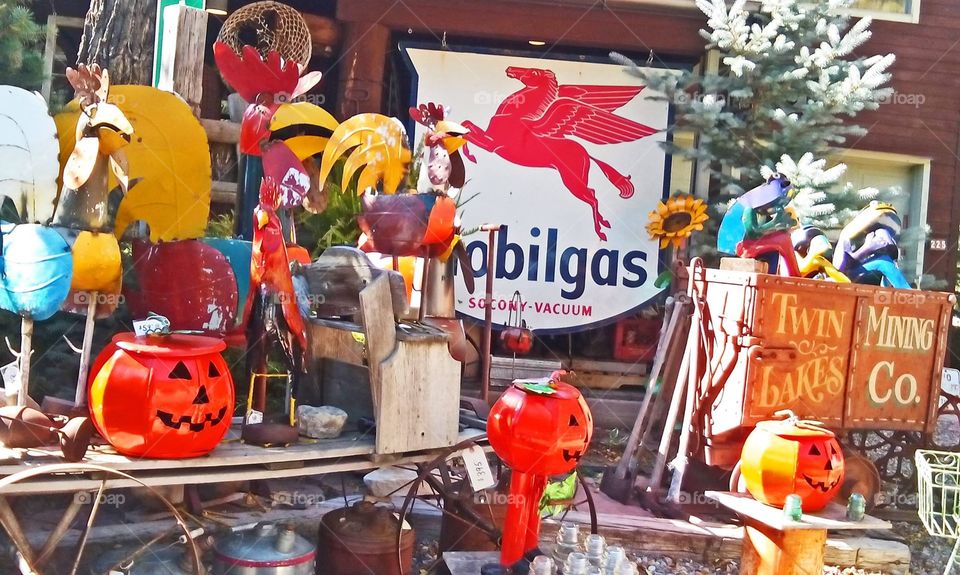 Colorful Autumn display in front of antique shop 