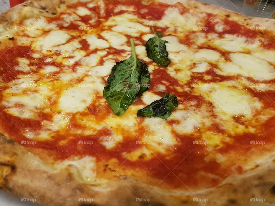 Delicious original pizza bought in Via dei Tribunali in Naples