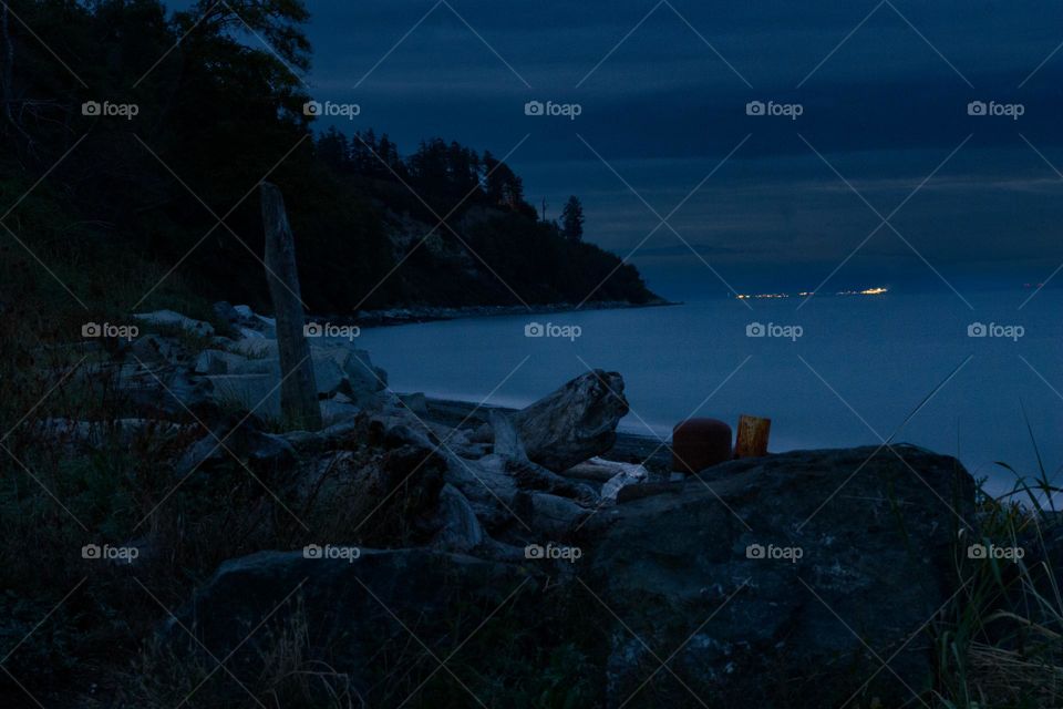 Nighttime shot of the beach. Soaking in as much light as possible with super wide aperture and super long shutter speed and a tripod. 