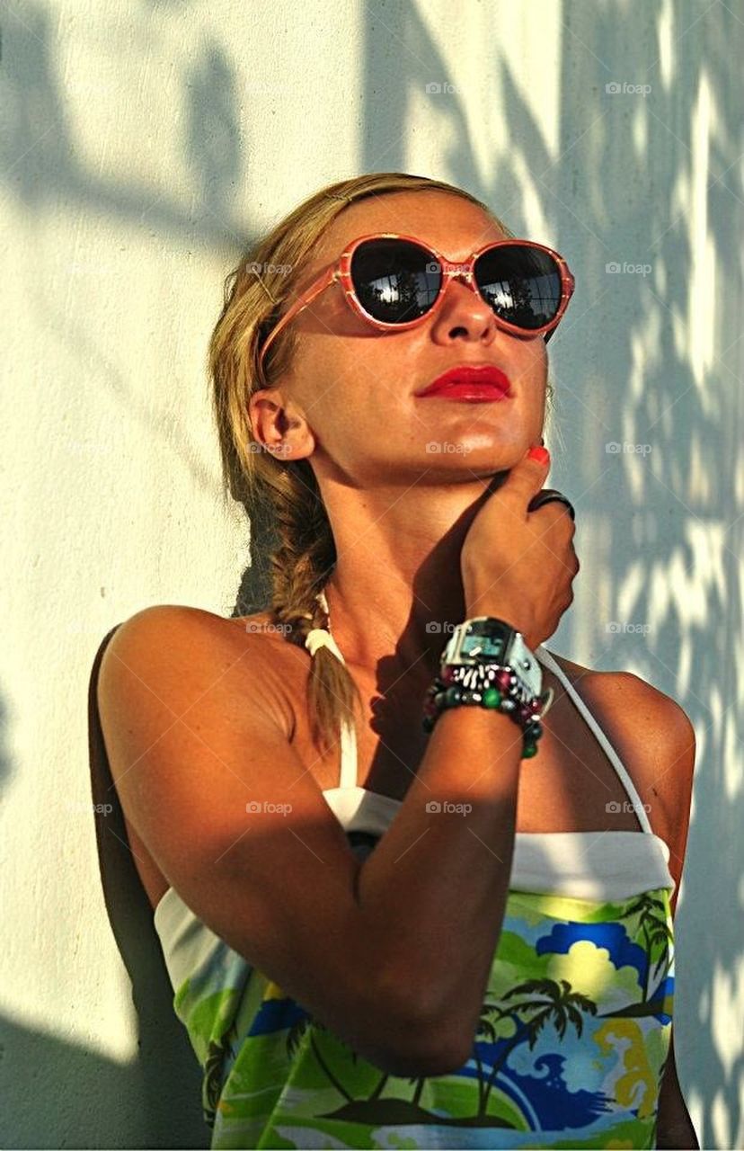 Young blonde woman with sunglasses 