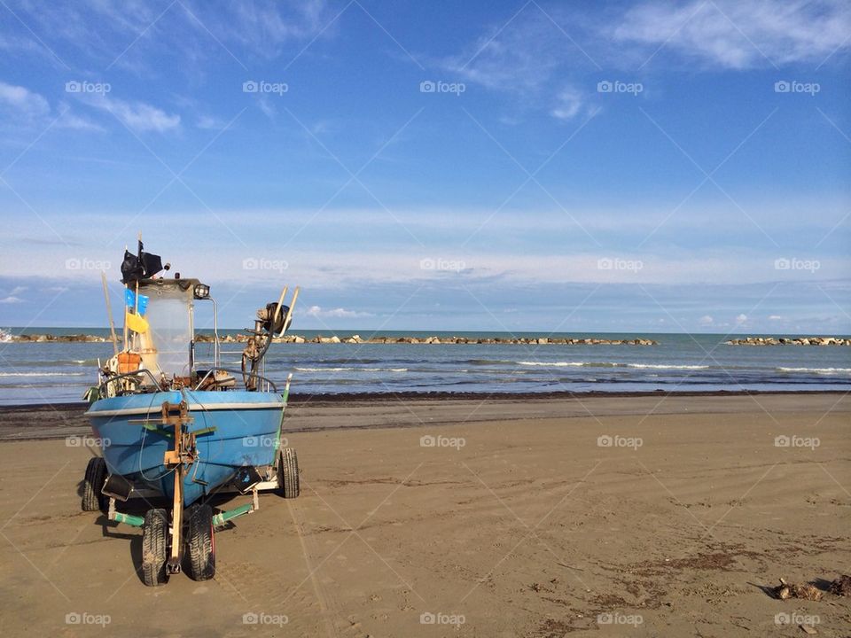 Boat on an empty beach