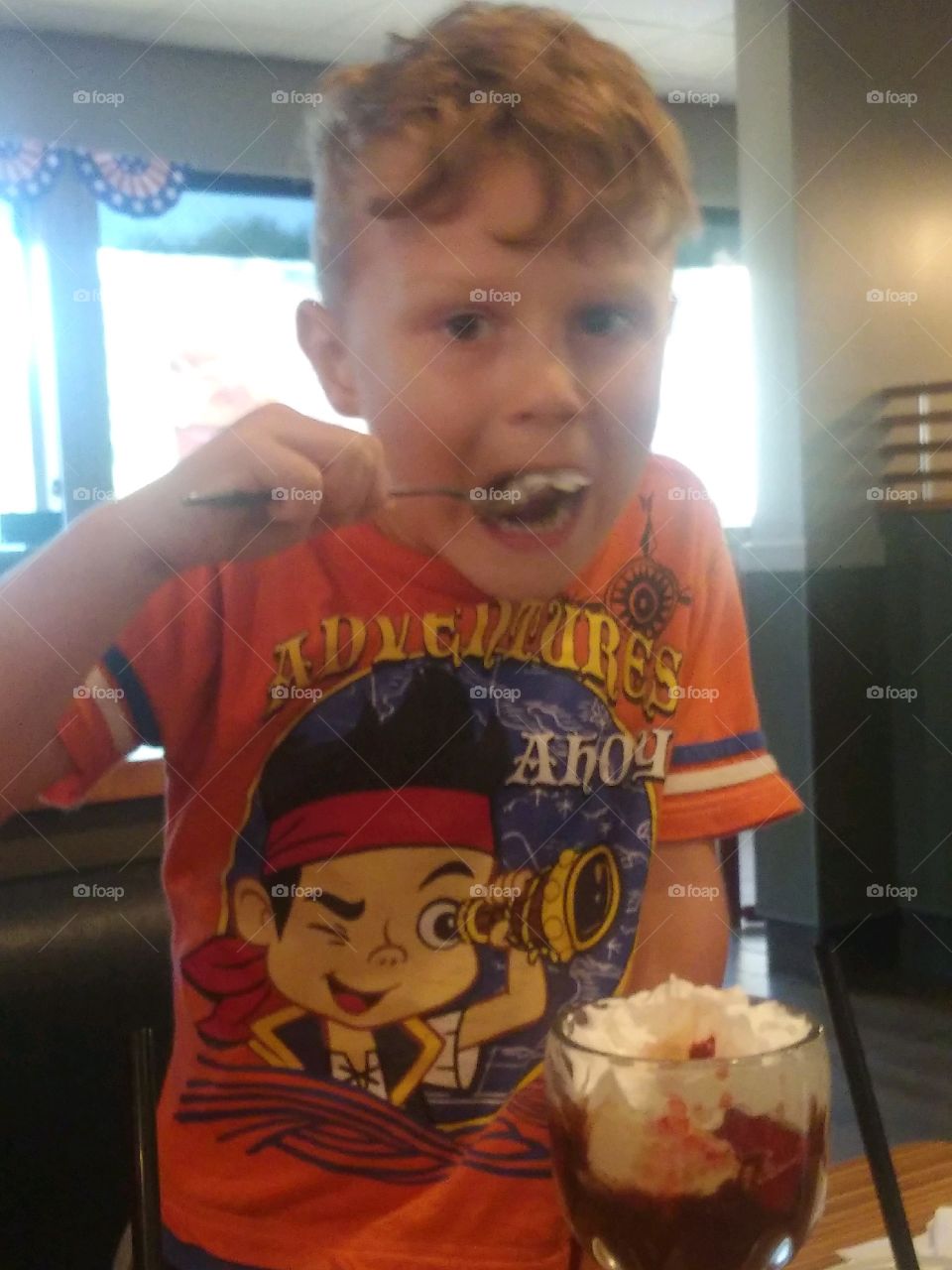 boy enjoying his ice cream