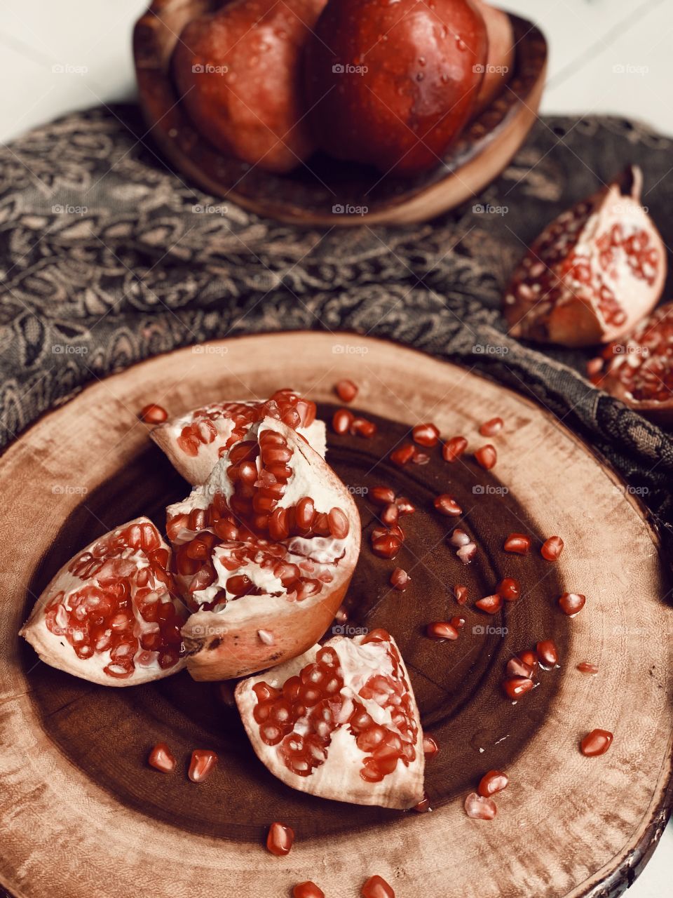 Pomegranate having fun with apples.