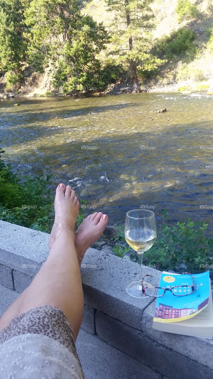 River balance. Relaxing beside the river