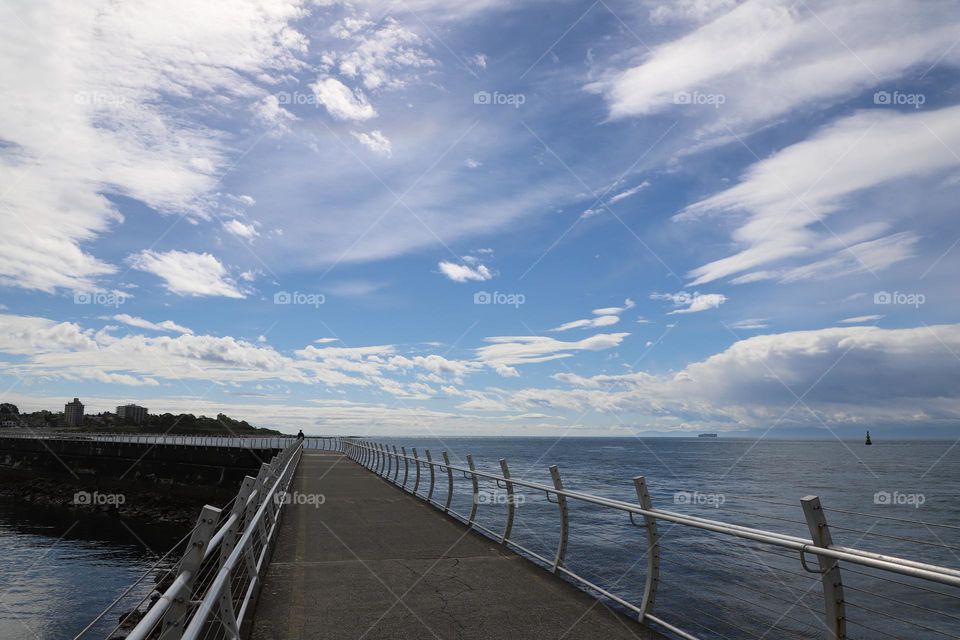 Beautiful sky over the breakwater 