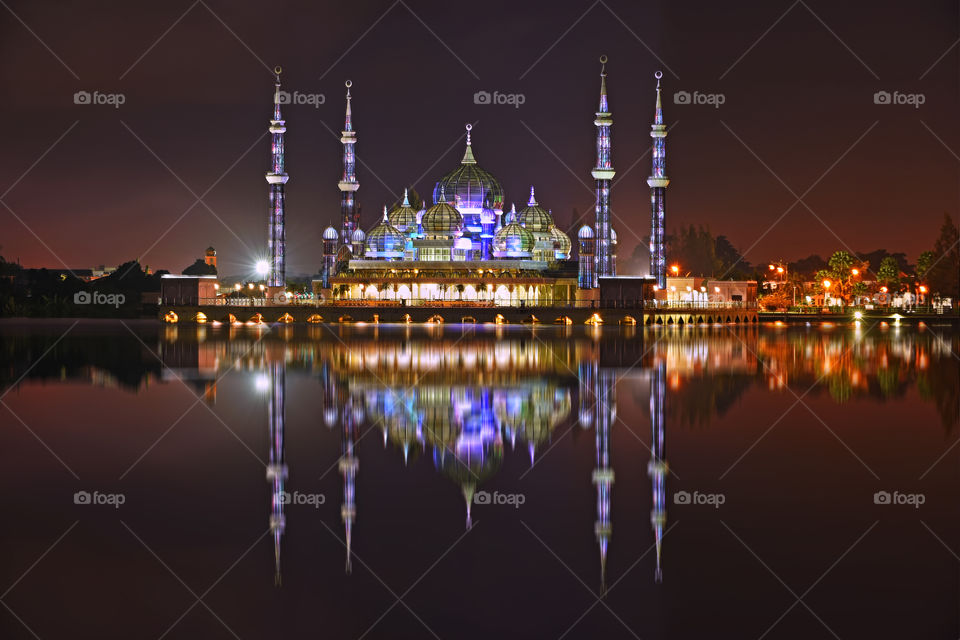Beautiful reflections of Crystal Mosque at night