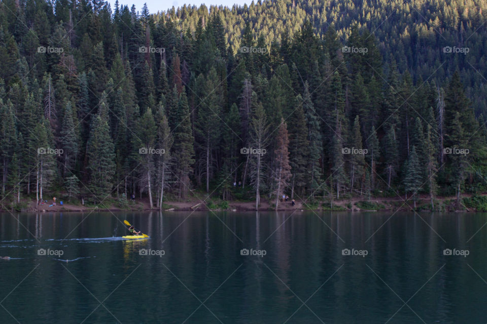 Kayaking in a mountain reservoir. 