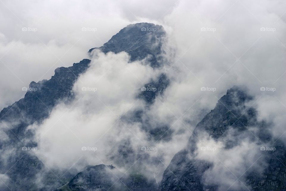 Mountain peak in clouds
