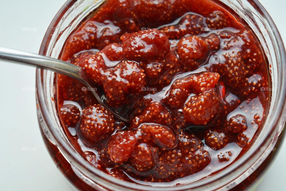 wild strawberries jam in glass bank tasty food