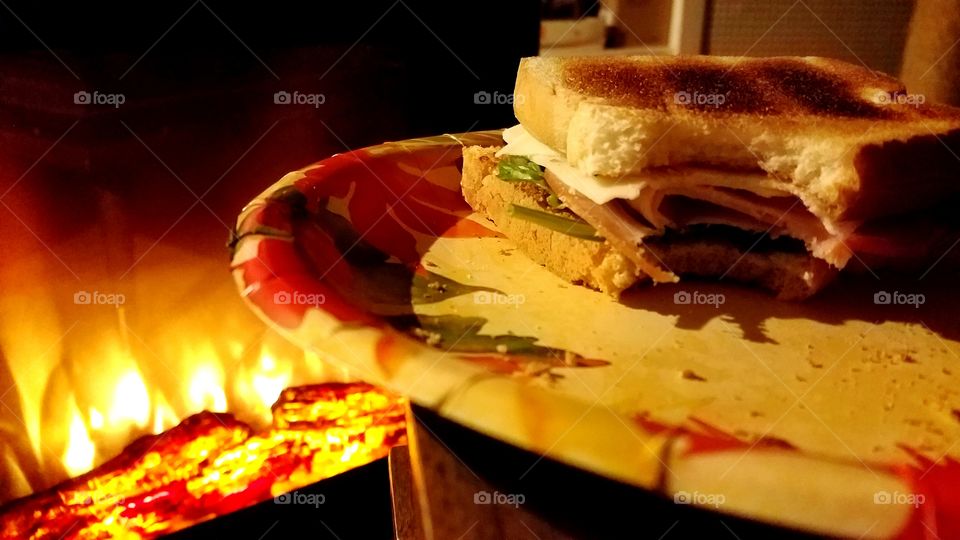 Sandwich by fireplace