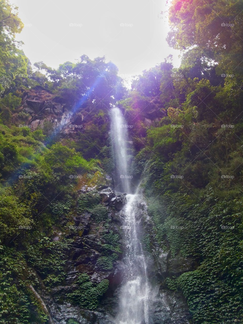 Rainbow over Coban Rais Waterfall