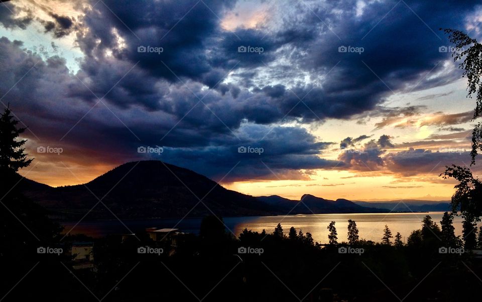 A stunning, yet stormy sunset over the Okanagan Valley Mountains, in Penticton B.C.