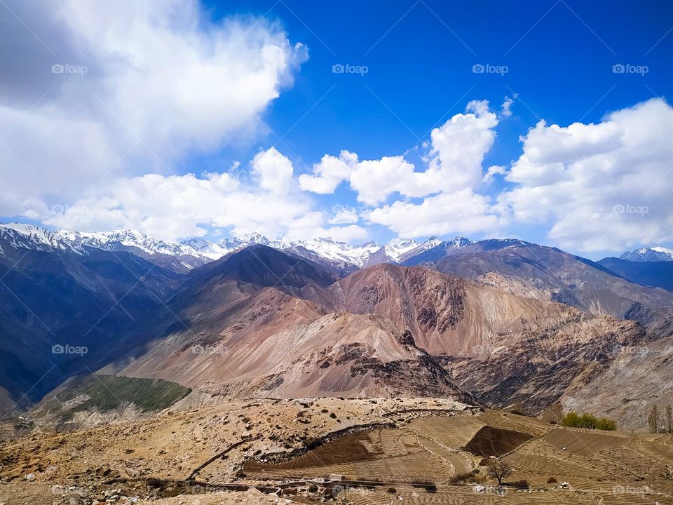 Amazing view of mountain landscape in the Himalayas with blue sky and clouds