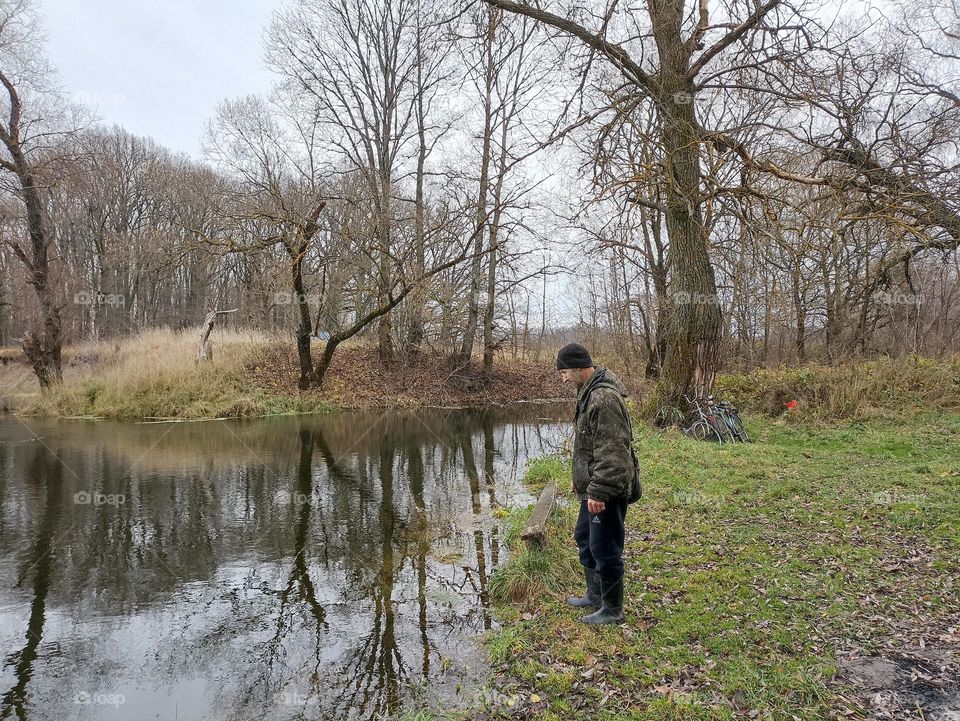 A man looking into the water