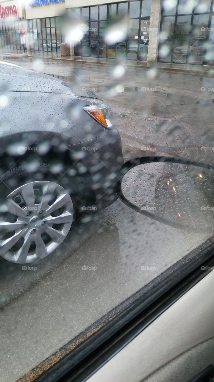 Tire and Mirror on a Rainy Day