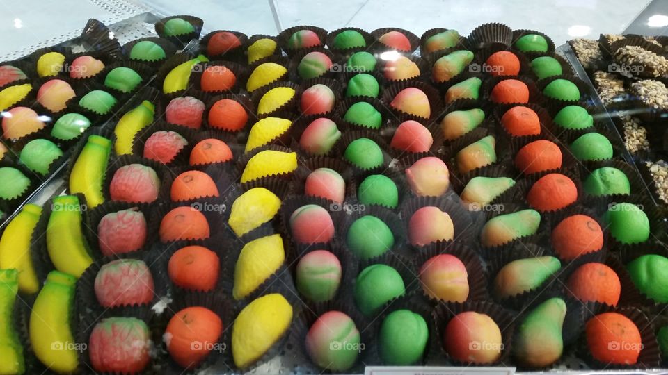 Sweet colorful marzipans shaped as fruits