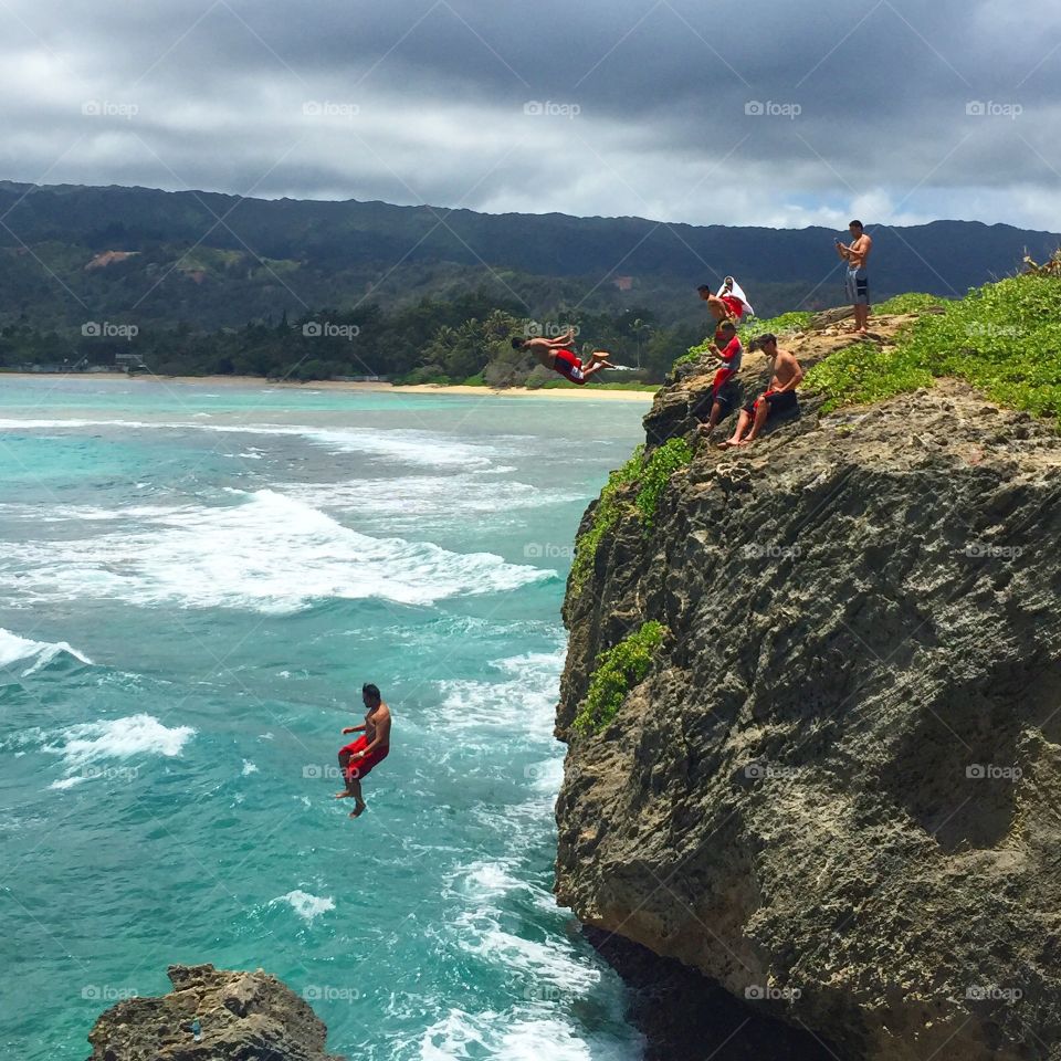 Cliff Diving at Laie Point. Cliff jumpers at Laie Point on Oahu