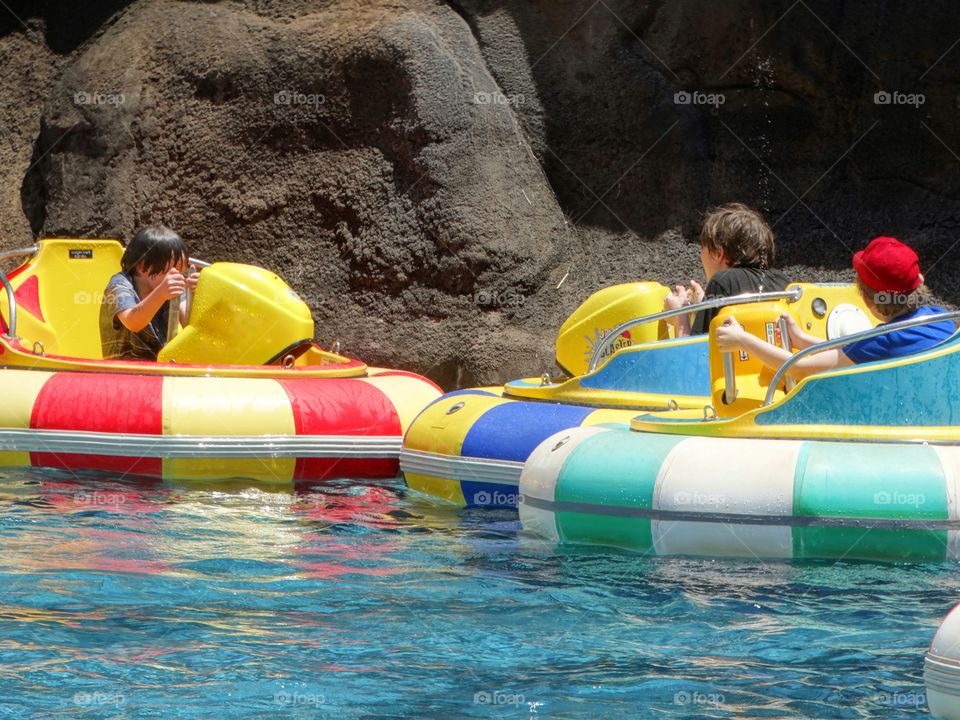 Boys Playing In Boats