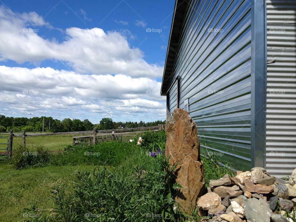 Side of barn overlooking huge field